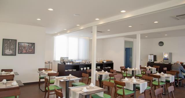 new arrangement of the breakfast room in the roof garden with views of castel sant ' elmo